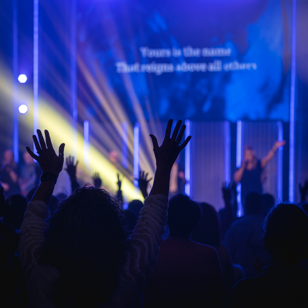 Hands raised up in the crowd during a song at Central Church's Night of Worship