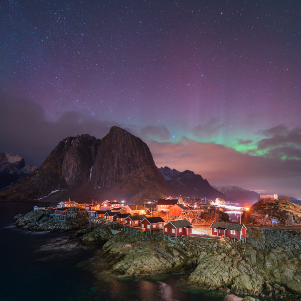 Aurora over the famous Hamnoy fishing village in Lofoten Norway